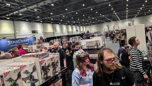 A photo of a booth at SALUTE 52 overlooking the convention hall.