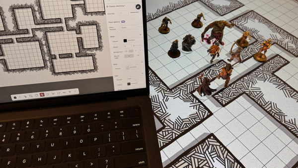 A laptop displaying a gridded Dungeons & Dragons map sits on top of a Digital Display projecting the same map, larger, on the table. A collection of painted minuatures rest on the table map. 